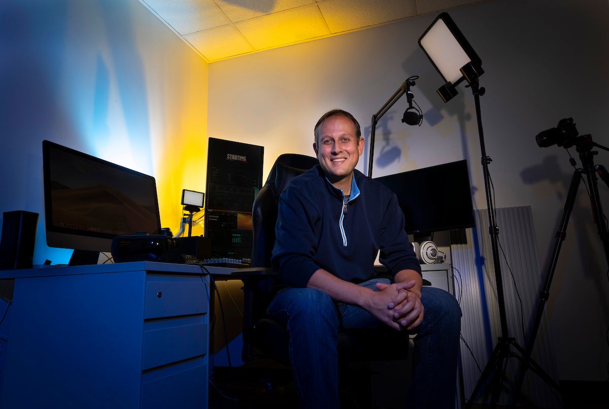 Assistant Professor Ilya Brookwell sits in the new MCS Livestreaming and VR Lab