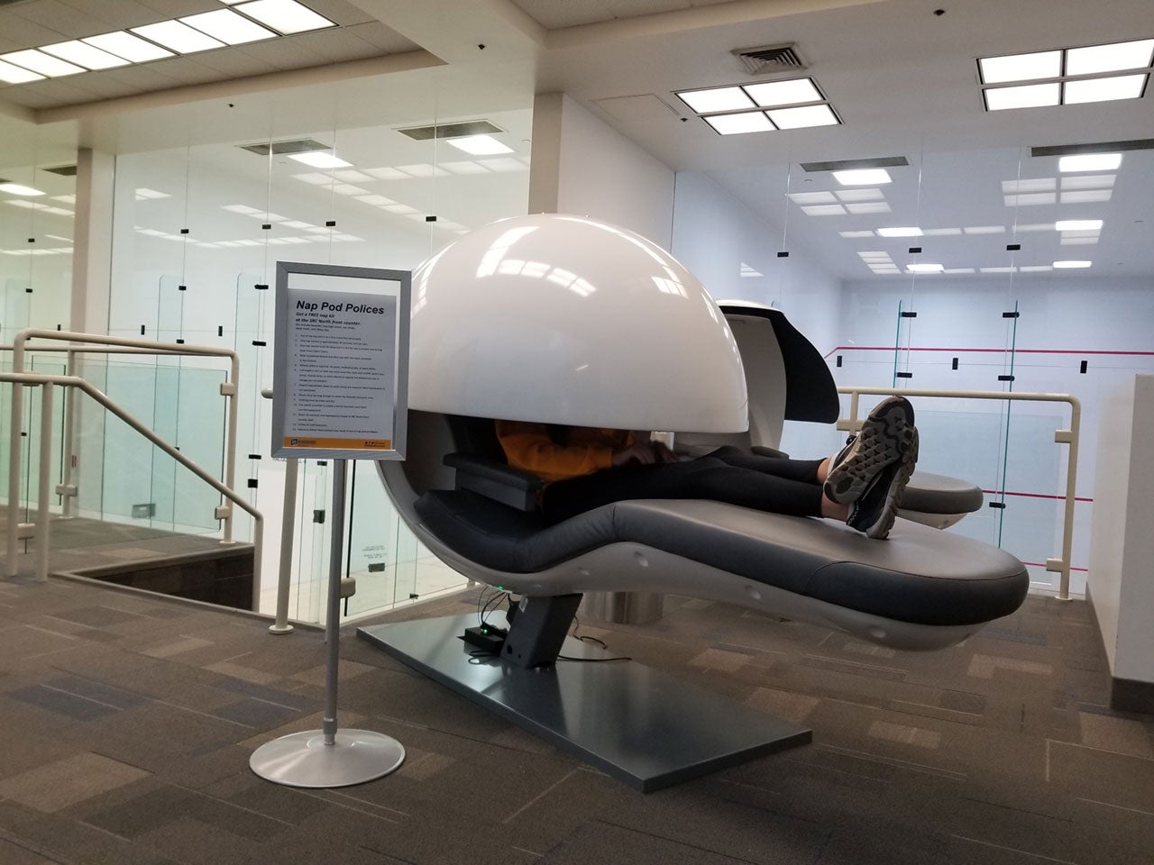 SRC student worker uses nap pod.