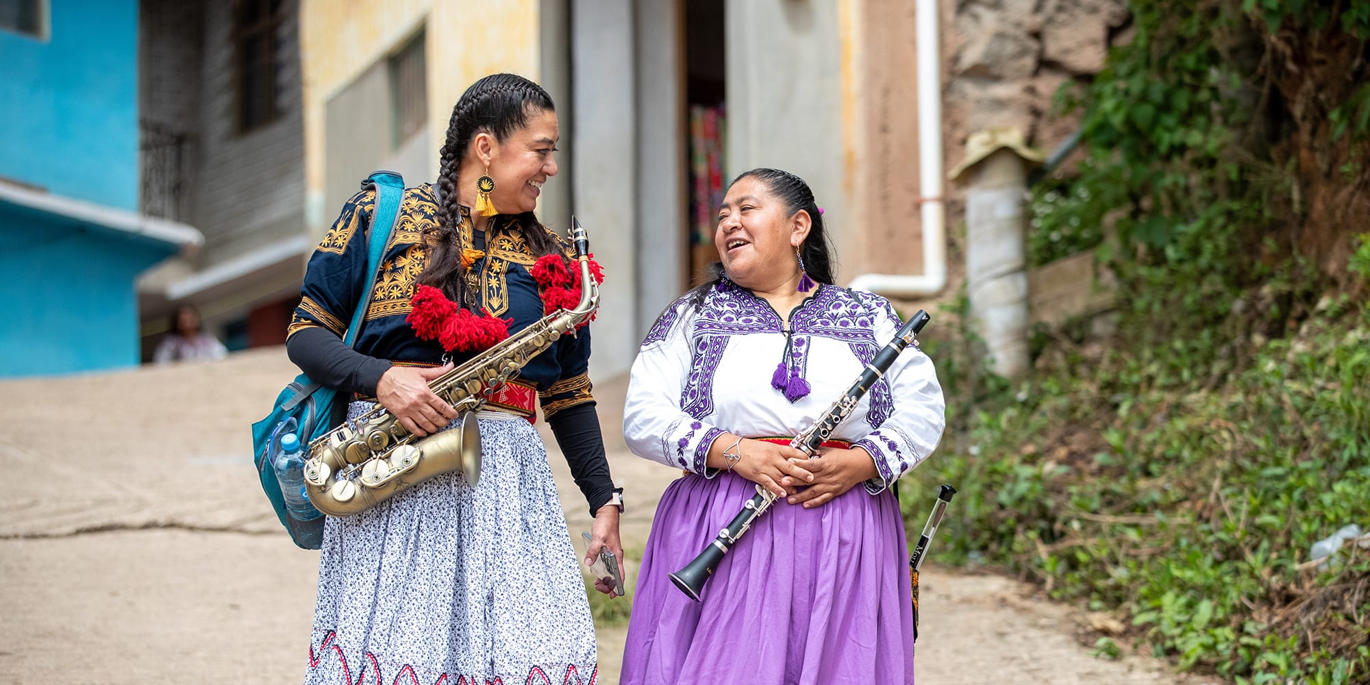 Chávez (left) and Gallardo Martinez head into town to perform for Sábado en Concierto