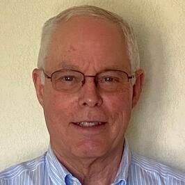 A headshot of Tom Delfino