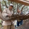 Community worker Eleuterio Cabrera Ortiz, left, and Anthropologist Ximena Aguilar Gonzalez, look for any collectable material sifted from soil taken from an excavation site.