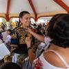 Chávez receives a pin after performing with Mujeres del Viento Florido in Tlahui.