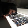 Sonja Sekely-Rowland looks at slide sheets with 35mm film. She is the visual resource collection curator at UC Riverside's Department of the History of Art. (UCR/Sandra Baltazar Martínez)  