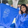 R'Pantry Volunteer displaying anniversary sweater (Stan Lim/UCR)