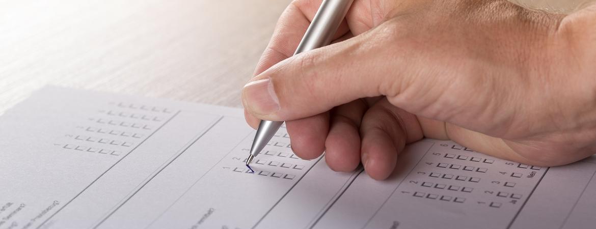 A person fills out an opinion poll