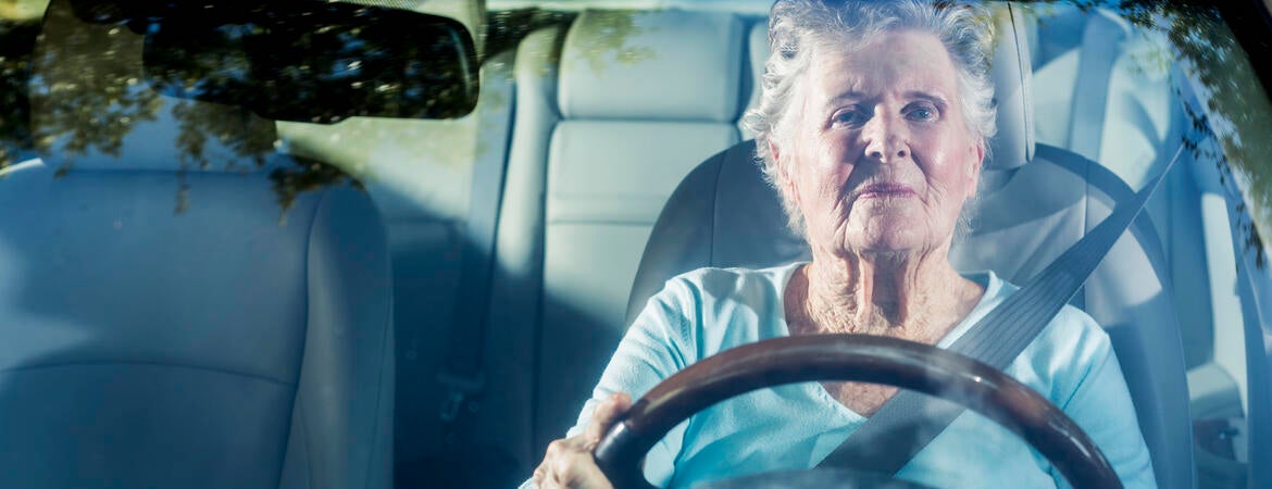 Senior citizen driving a car