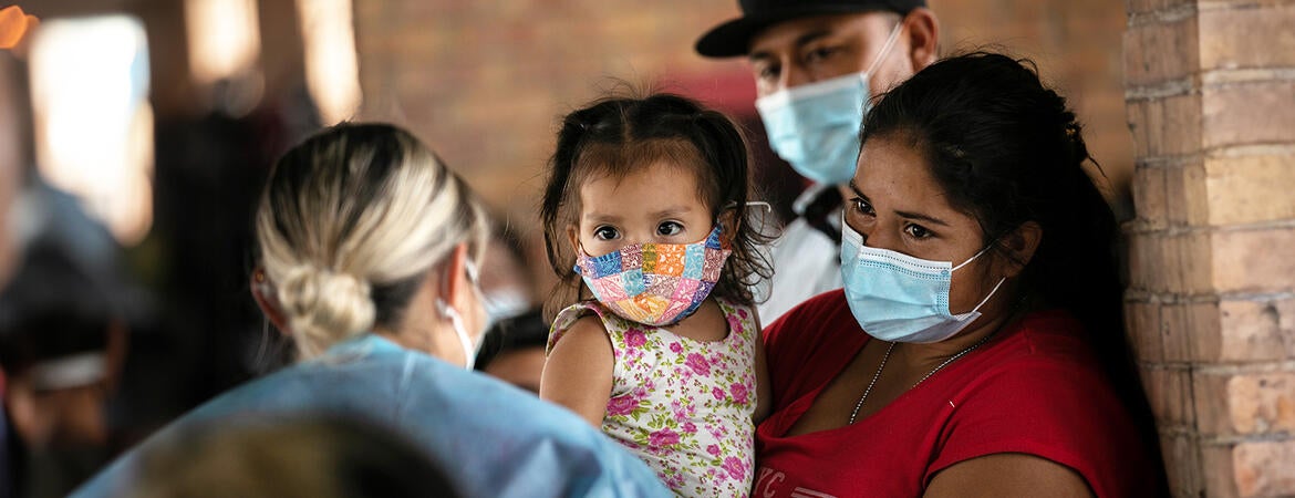 An immigrant family sees a nurse in Brownsville, Texas.