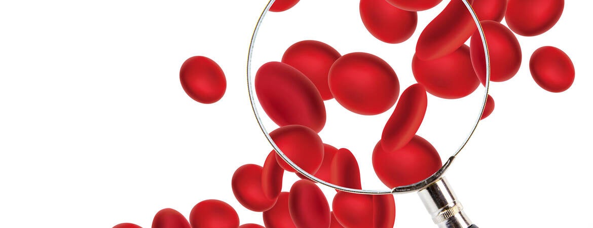 Red blood cells and a magnifying glass