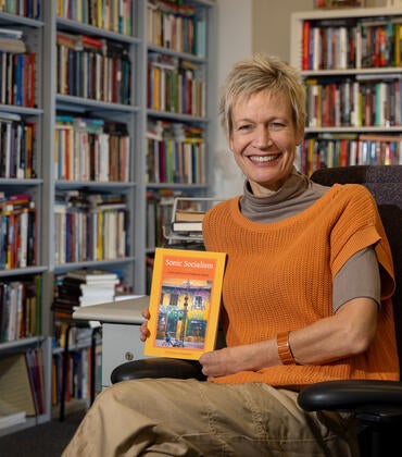 Christina Schwenkel with her book