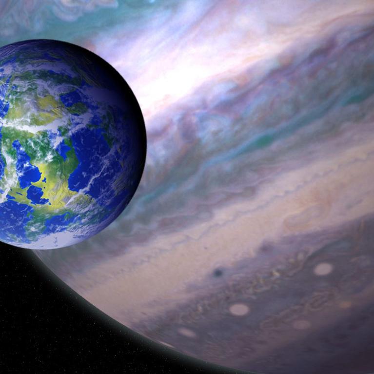 An artist’s illustration of a potentially habitable exomoon orbiting a giant planet in a distant solar system. NASA GSFC: Jay Friedlander and Britt Griswold