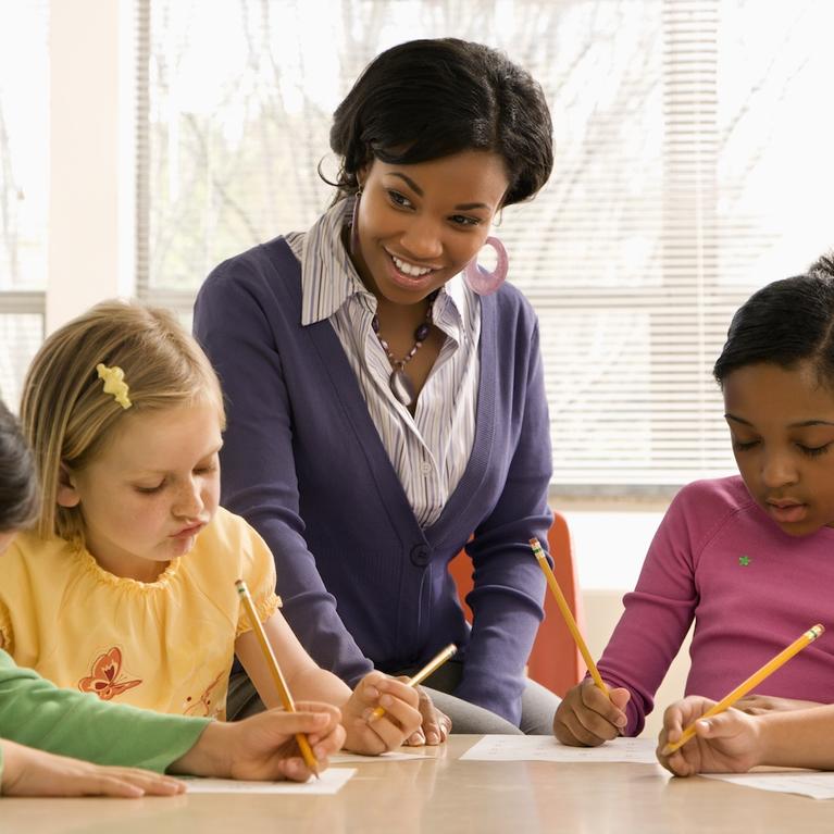 A teacher teaching young children.