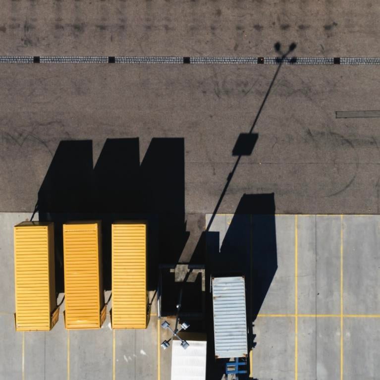 Trucks parked in front of a warehouse