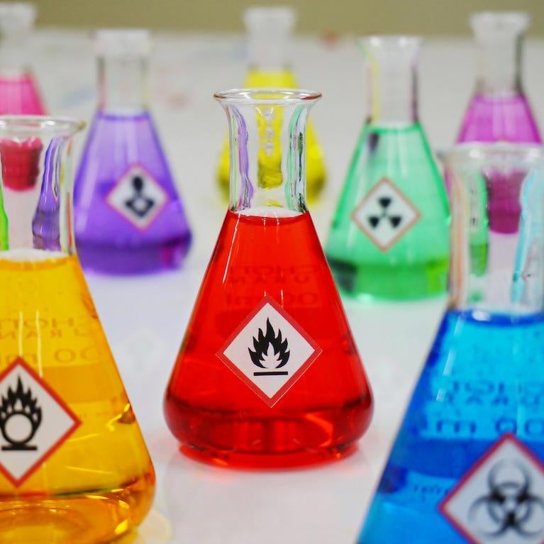 Bottles of chemicals with hazard labels