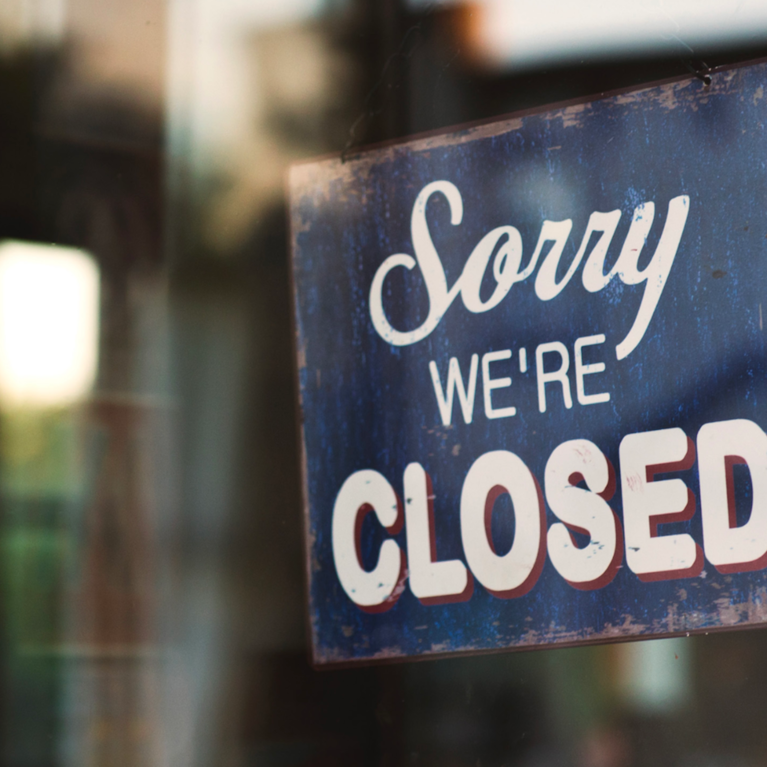 A shop with a closed sign.
