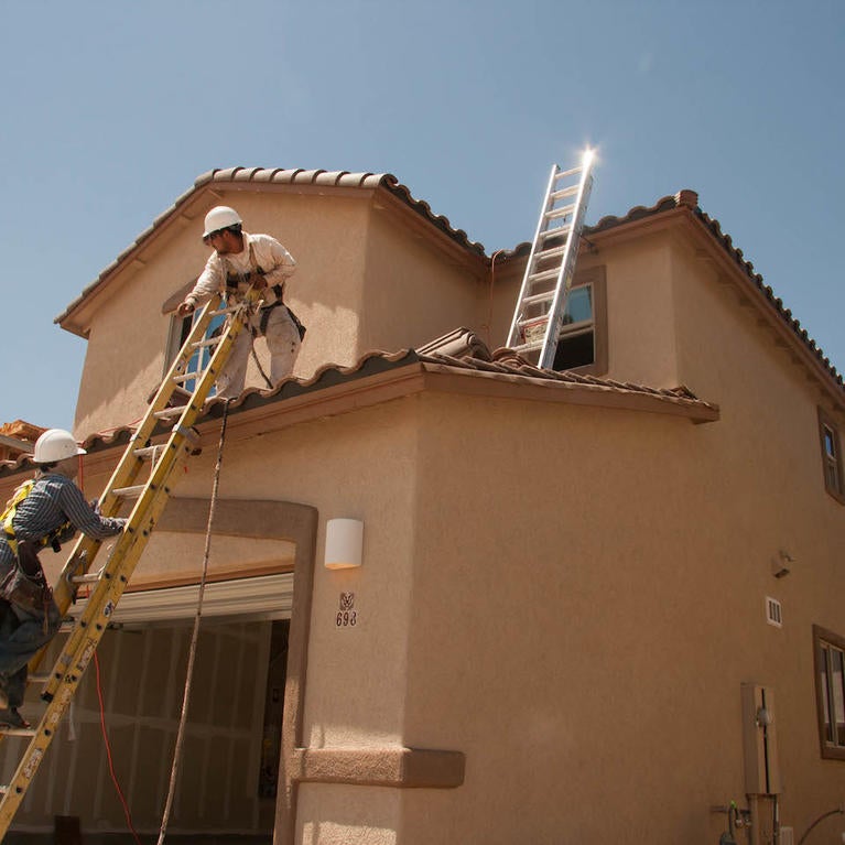 construction workers building a house