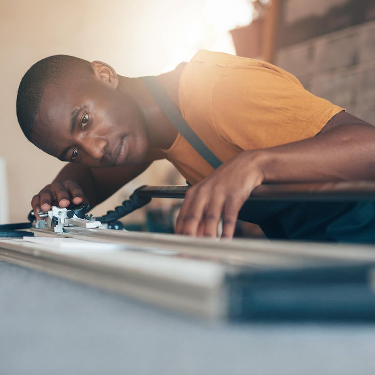 A worker calibrates an instrument or machine