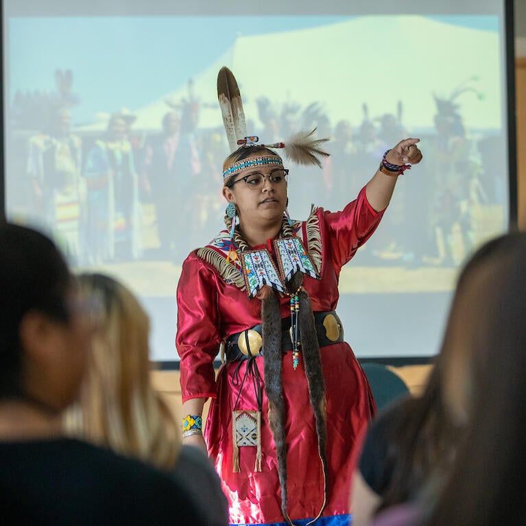 Katianna Warren, UCR's former Pow Wow Princess, answers questions for Native American youth during an activity in Bear Cave as part of Gathering of the Tribes Summer Residential Program on Thursday, June 27, 2022 at UC Riverside.  (UCR/Stan Lim)
