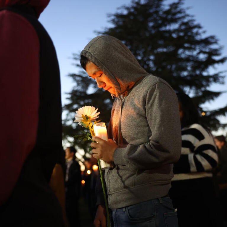 MONTEREY PARK, CALIFORNIA - JANUARY 24: People attend a candlelight vigil for victims of a deadly mass shooting at a ballroom dance studio on January 24, 2023 in Monterey Park, California. Eleven people died and nine more were injured at the studio near a Lunar New Year celebration last Saturday night. Vice President Kamala Harris is scheduled to visit the predominantly Asian American community tomorrow. (Photo by Mario Tama/Getty Images)