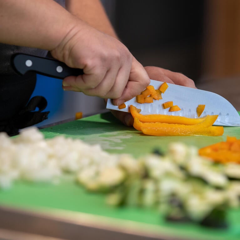 Chef Val cutting vegetables