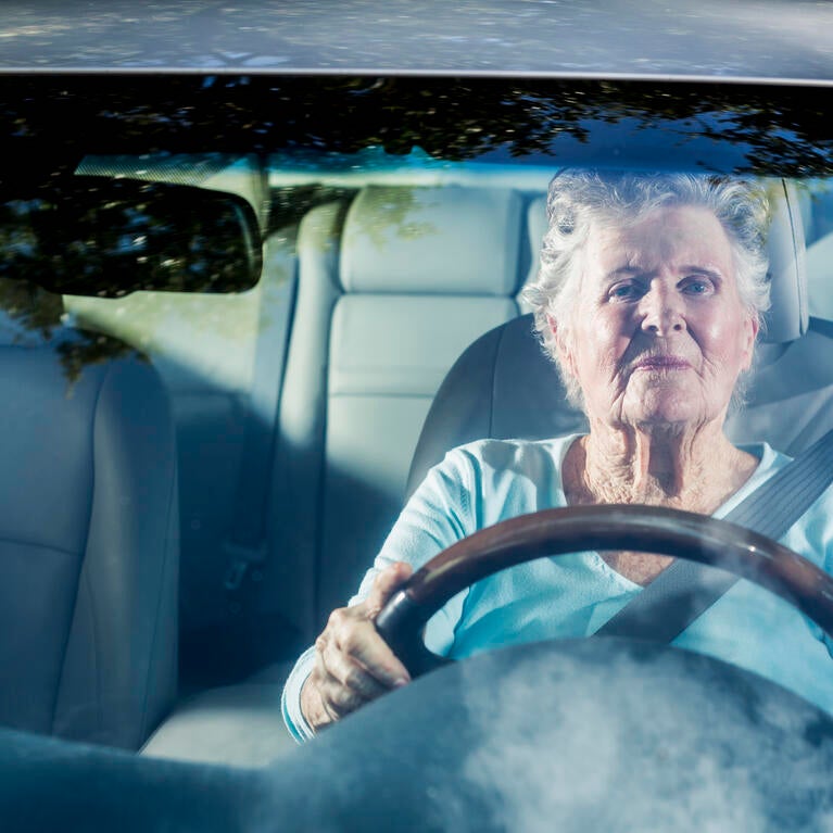 Senior citizen driving a car