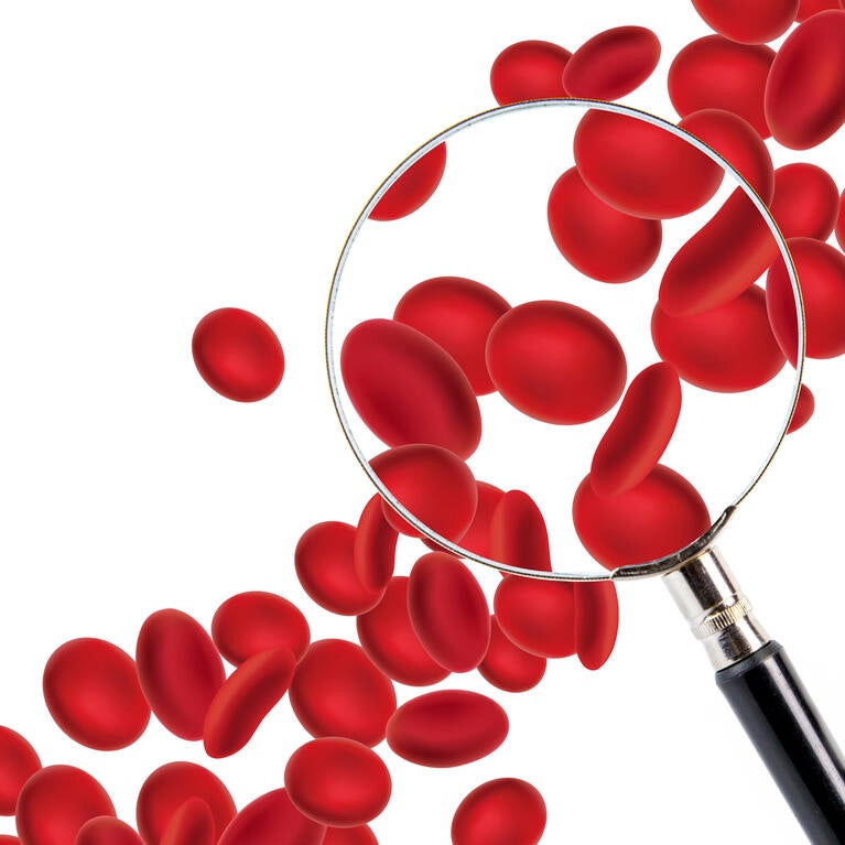 Red blood cells and a magnifying glass