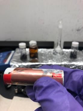 An electric car battery with a chemical leak