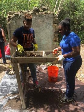 Archaeologists screening artifacts