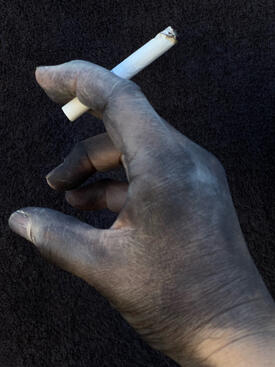 Hand holding cigarette