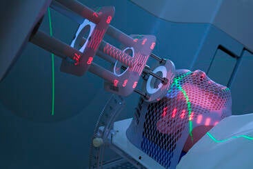 man receiving radiotherapy treatment