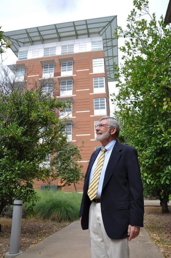 In the early 1990s, as associate CHASS dean, Carl Cranor led a UCR faculty and staff committee that helped guide the development and design of the College of Humanities, Arts, and Social Sciences (CHASS) building, partially seen in the background. CHASS was designed by renowned Argentinian architect César Pelli. (UCR/Sandra Baltazar Martinez)