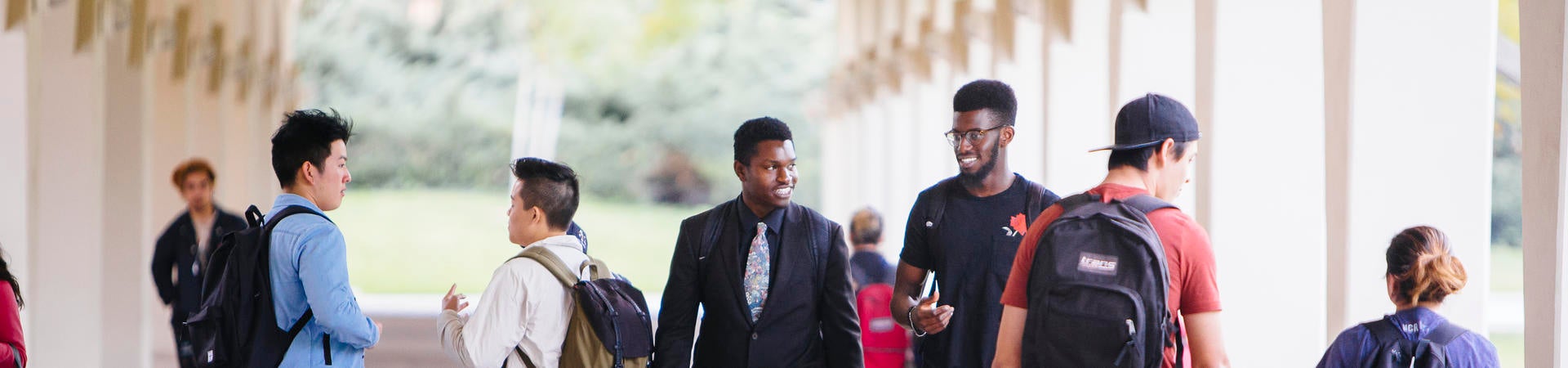 Students walking in the Rivera Library archway
