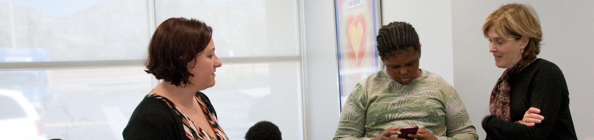 SEARCH Center staff talking to a patient