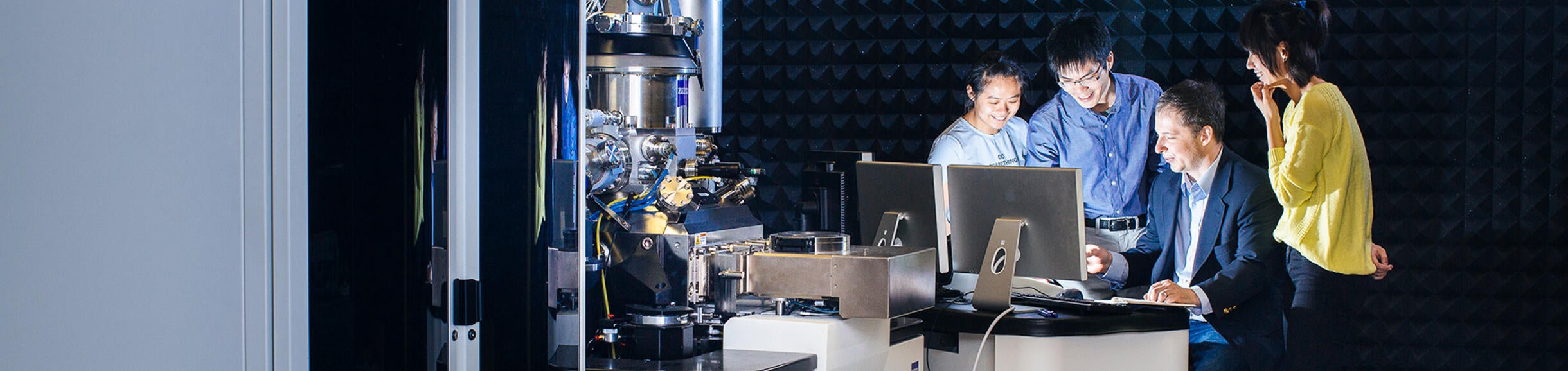UCR Physics students in the lab with their professor (c) UCR/Stan Lim