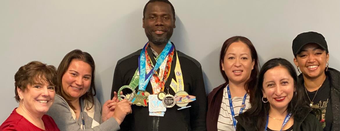 Isaac Owusu-Frimpong with his marathon medals