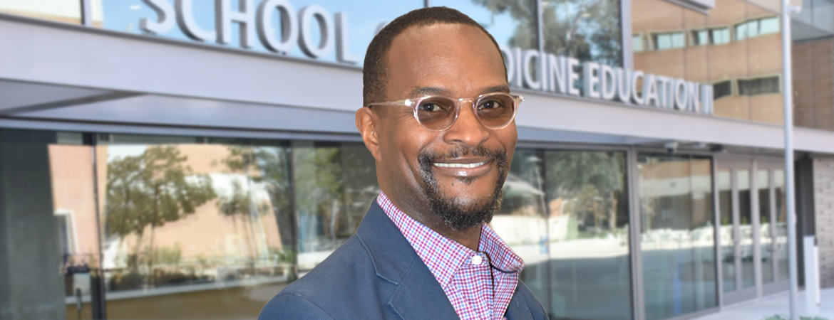 Dr. Mario Sims in front of the Ed Building 2