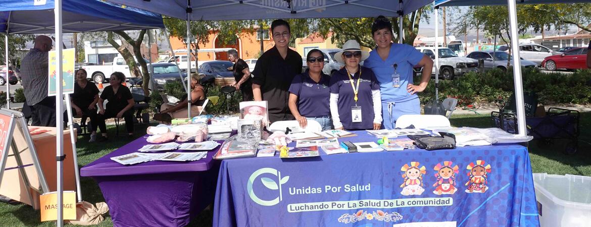 Joslyn Santana, far right, and others tabling for Unidas Por Salud