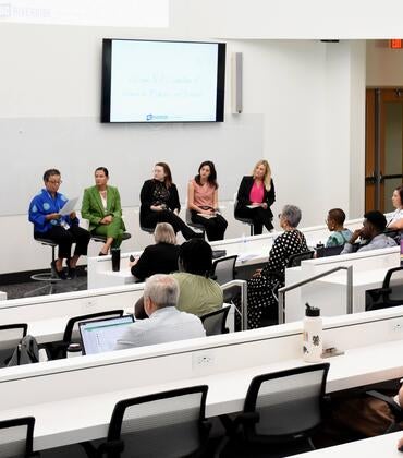 Audience watching the panelists at the WIMS 2025 event