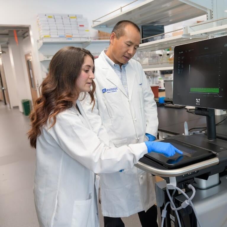 Rebecca Hernandez, left, with Dr. Changcheng Zhou