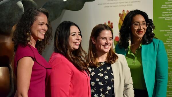 Four women smiling for a picture