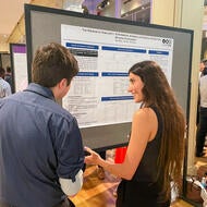 A woman presenting her research