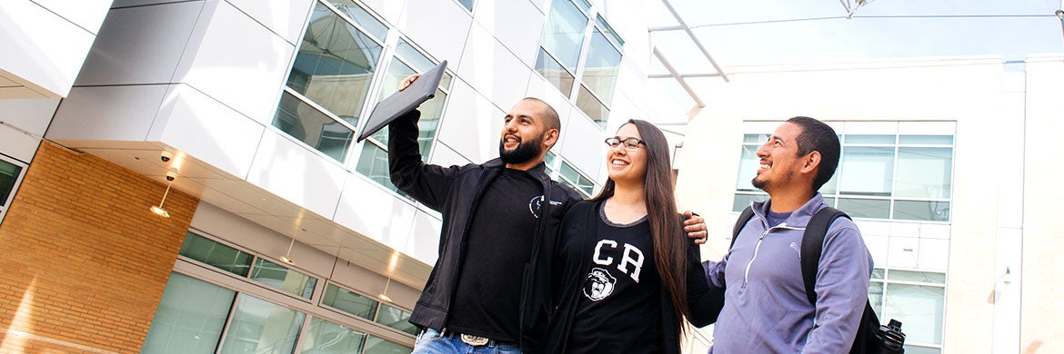 Three students walk through a courtyard at the Marlan and Rosemary Bourns College of Engineering