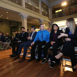 Three grad students in conversation