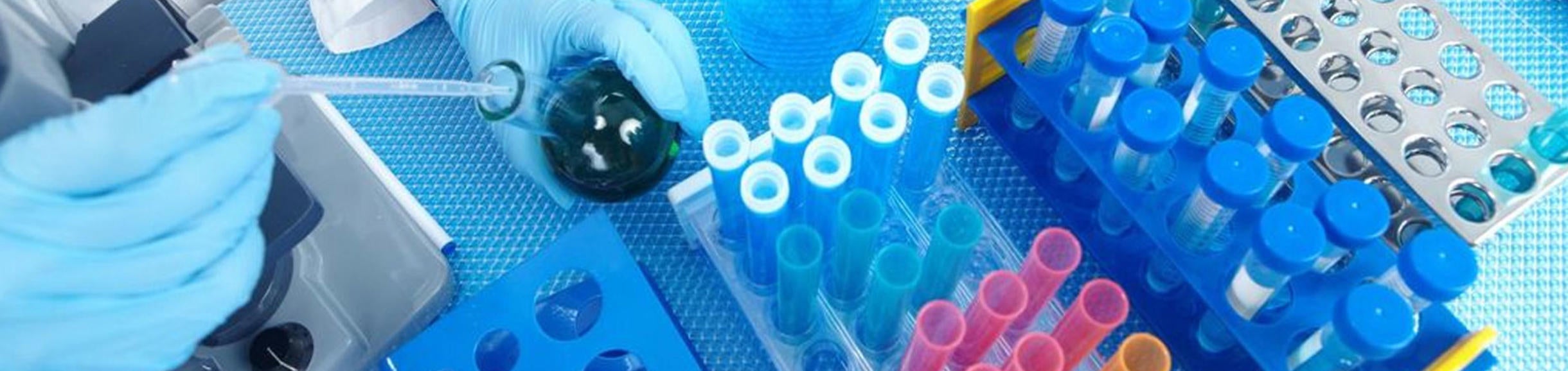 test tubes and a beaker, testing in a lab (c) iStock