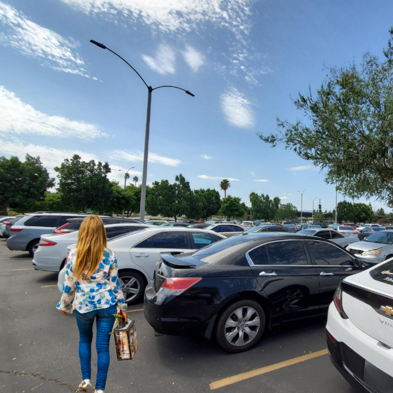 woman walking in parking lot