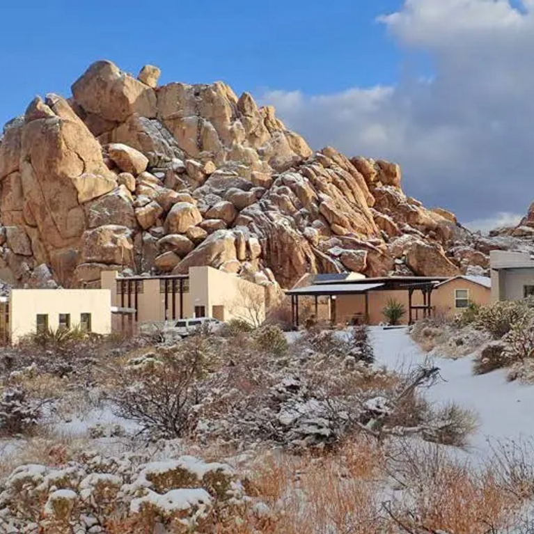 Field station buildings among rocks in snow