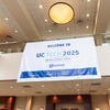 UC Tech 2025 banner hanging inside the venue.