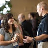 Attendees socializing with each other.