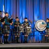 UC Riverside Pipe Band performing on stage.