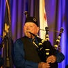UC Riverside Pipe Band performing on stage.