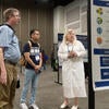 Attendees viewing posters at the poster showcase.